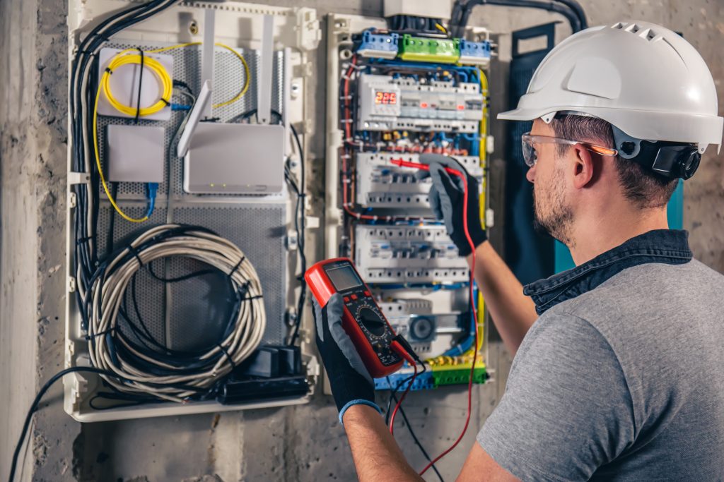 Man at fuse box