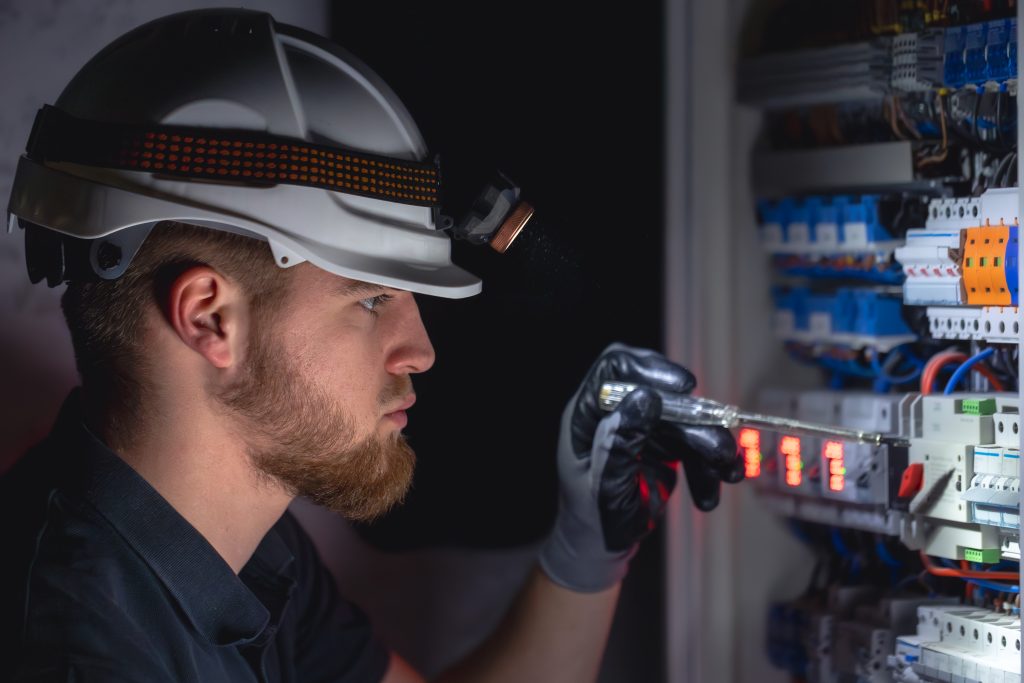 Man looking at electrical panel